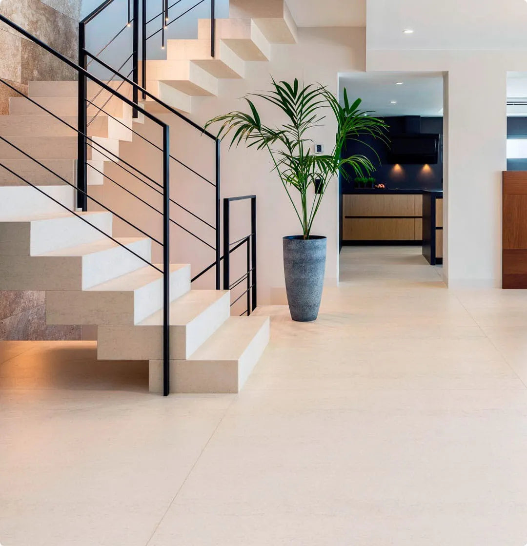 Dekton flooring with light beige finish and sleek modern staircase design — like dekton countertops installed by Signature Stone Las Vegas