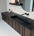 Silestone bathroom vanity with dark charcoal finish and integrated trough sink — modern quartz countertops installed by Signature Stone Las Vegas