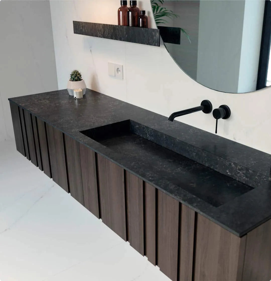 Silestone bathroom vanity with dark charcoal finish and integrated trough sink — modern quartz countertops installed by Signature Stone Las Vegas