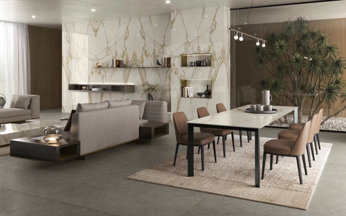 Calacatta Gold marble dining table with white base and dramatic gold veining — custom countertops fabricated and installed by Signature Stone LV