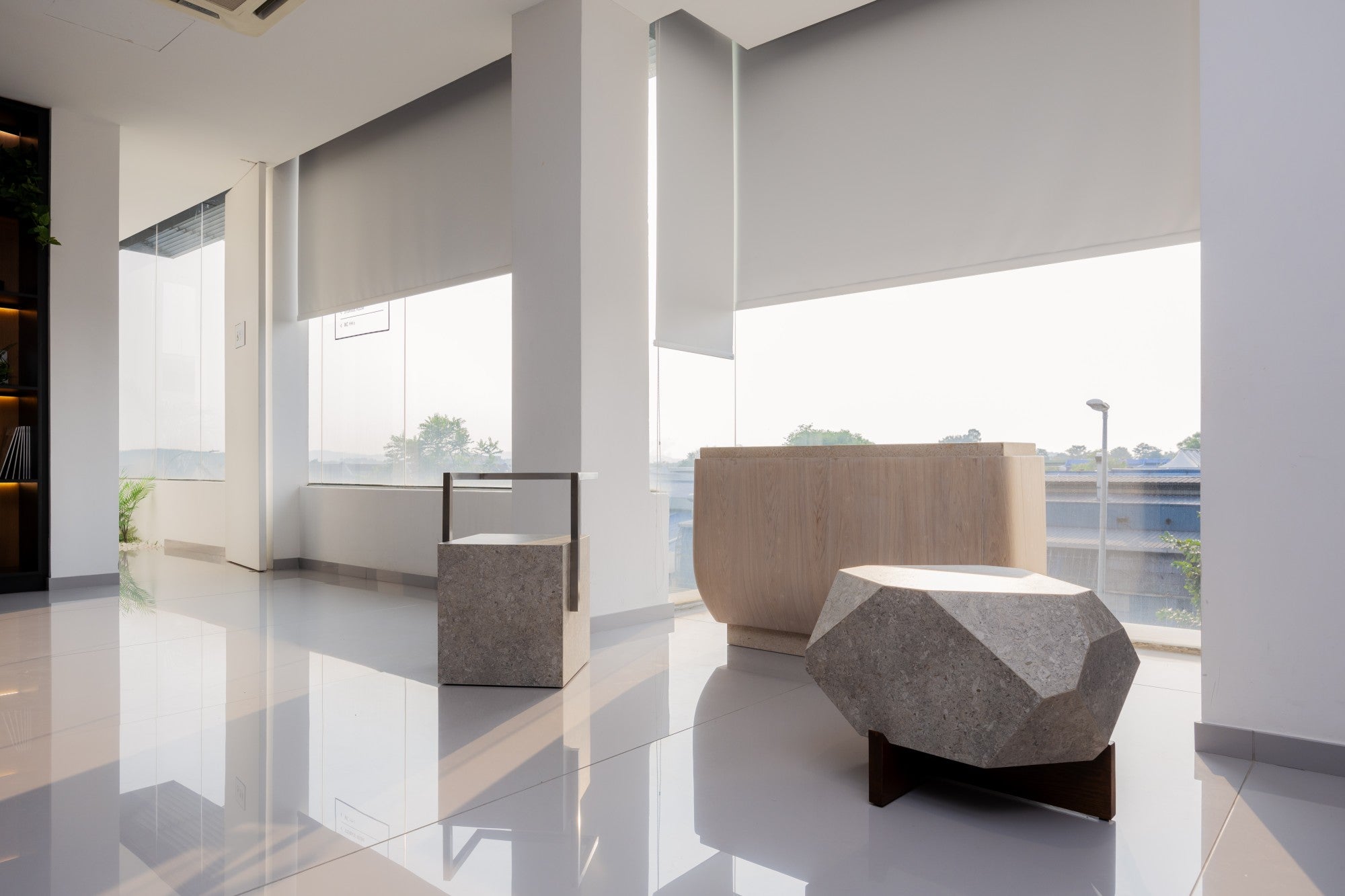 Dekton Avorio surfaces in modern lobby with light cream finish and geometric seating — premium dekton kitchen countertops by Signature Stone Las Vegas