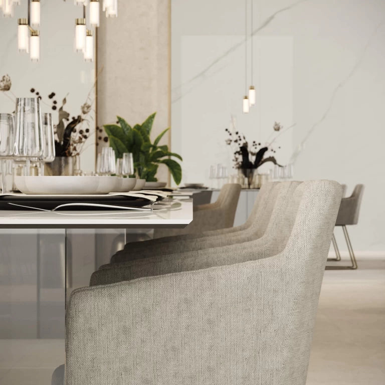 Calacatta Meraviglia marble dining table with white veining and modern chairs — expert countertop fabrication by Signature Stone Las Vegas