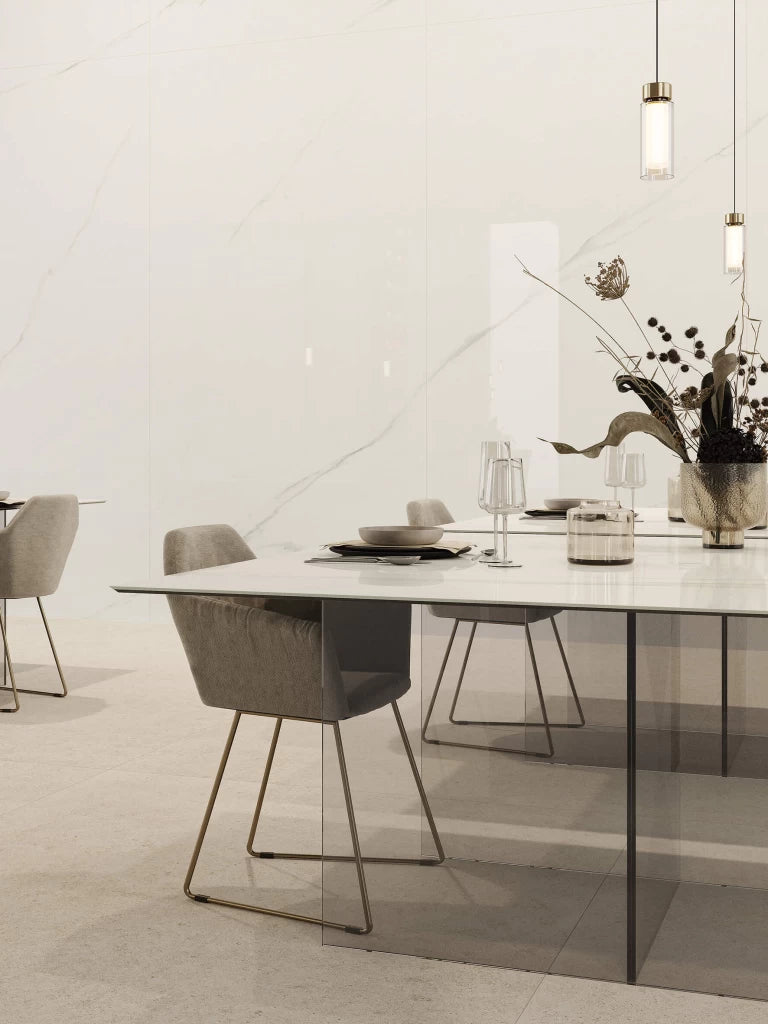 Calacatta Meraviglia dining table with white marble veining and sleek edges — premium stone countertops installed by Signature Stone Las Vegas