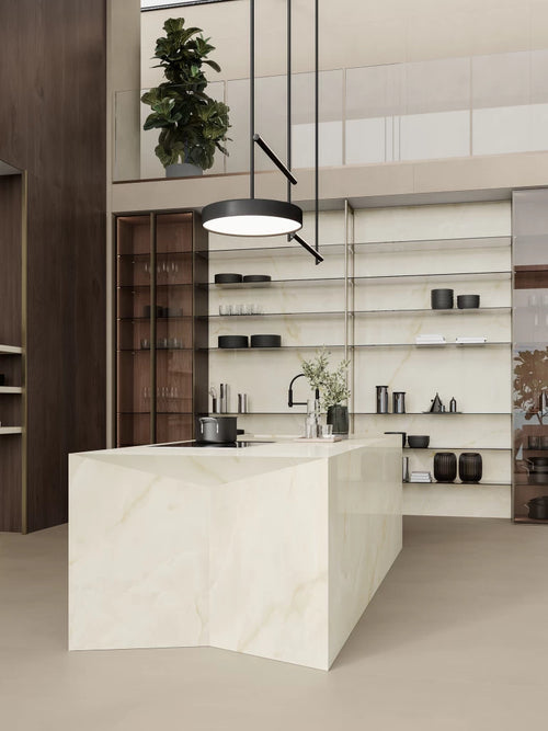 Onyx White kitchen island with waterfall edge and matching shelving in modern design — custom countertops fabricated and installed by Signature Stone LV