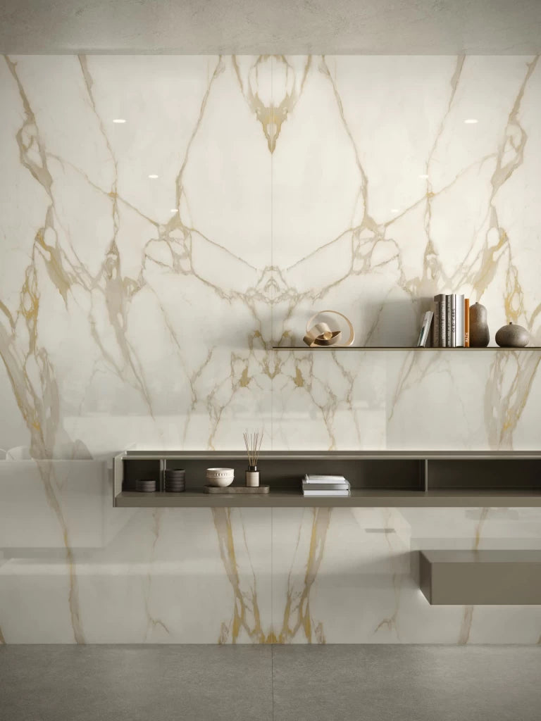 Calacatta Gold marble wall cladding with dramatic white and gold veining in modern bathroom — luxury stone countertops installed by Signature Stone Las Vegas