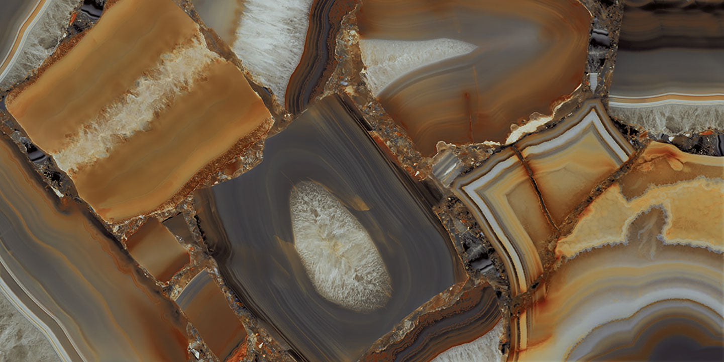 Agata Fuoco natural stone slabs with golden amber bands and white crystalline centers — premium stone countertops installed by Signature Stone Las Vegas