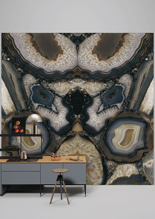 Agata Terra stone wallpaper featuring dramatic blue and cream geode patterns with natural banding — custom countertops fabricated and installed by Signature ...