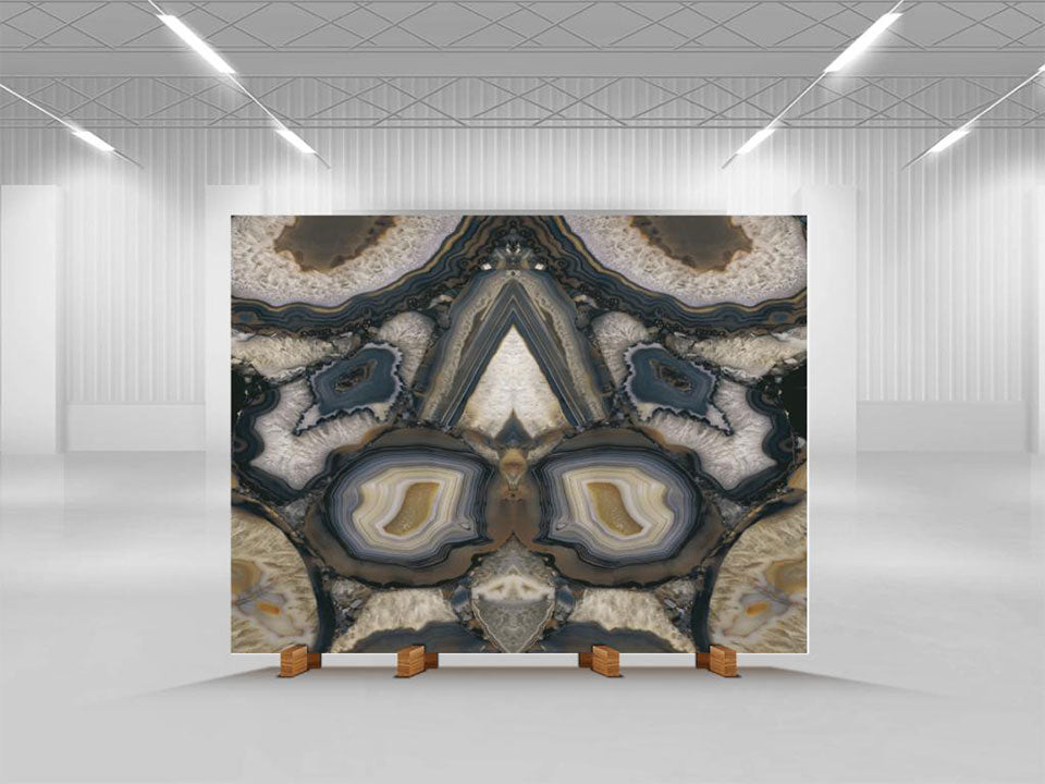 Agata Terra stone slab with symmetrical agate patterns in cream, blue and gold tones — luxury stone countertops installed by Signature Stone Las Vegas