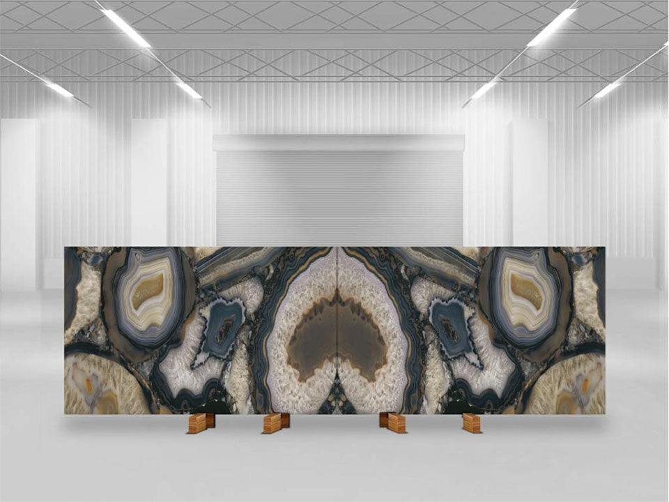 Agata Terra slab display showcasing dramatic geode patterns in blue, cream, and gold tones — premium stone countertops installed by Signature Stone Las Vegas