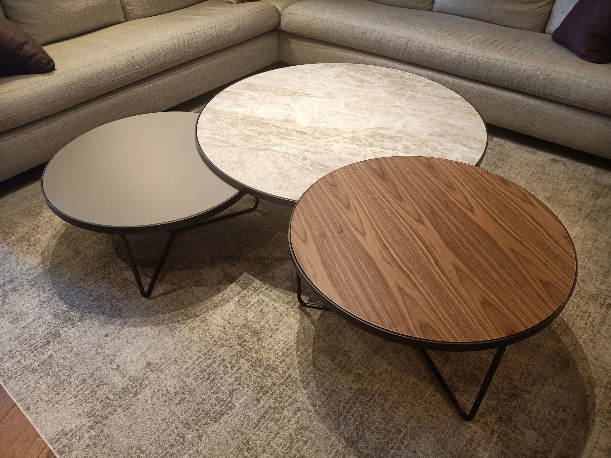 Dekton Arga round coffee table tops with light marble-like finish and geometric patterns — dekton kitchen countertops by Signature Stone Las Vegas