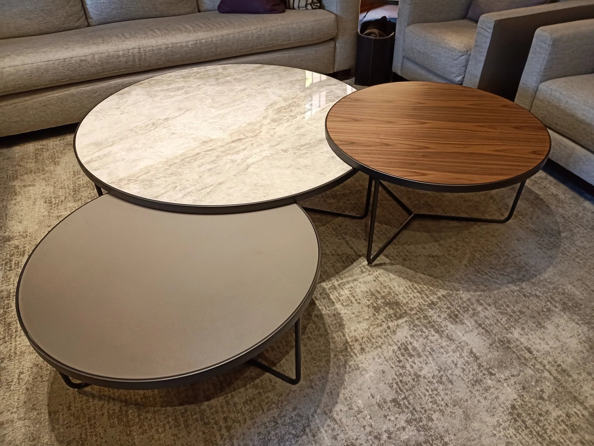 Dekton Arga coffee tables with polished white marble-look finish and warm wood grain — ideal for dekton kitchen countertops by Signature Stone Las Vegas