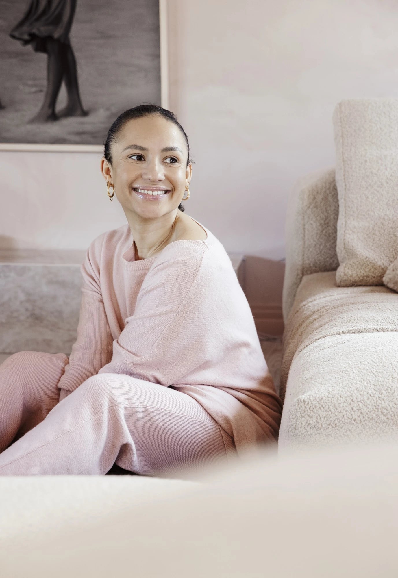 Dekton Arga surfaces in soft pink living room with textured beige sofa — premium dekton countertops installed by Signature Stone Las Vegas