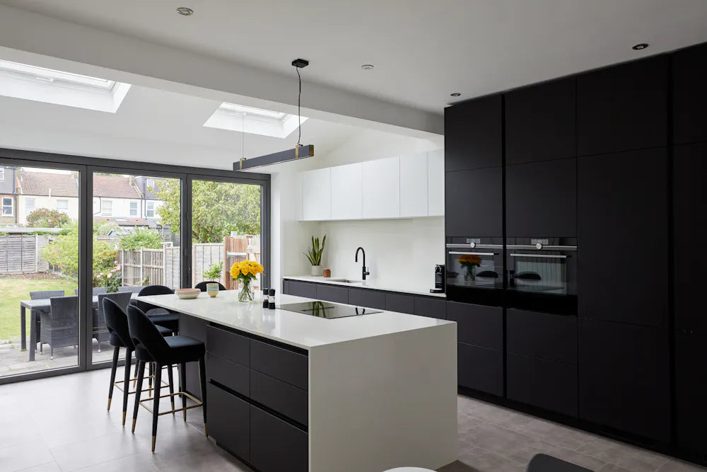 Silestone Ariel kitchen island with white smooth finish and waterfall edge — premium engineered quartz countertops fabricated and installed by Signature Ston...