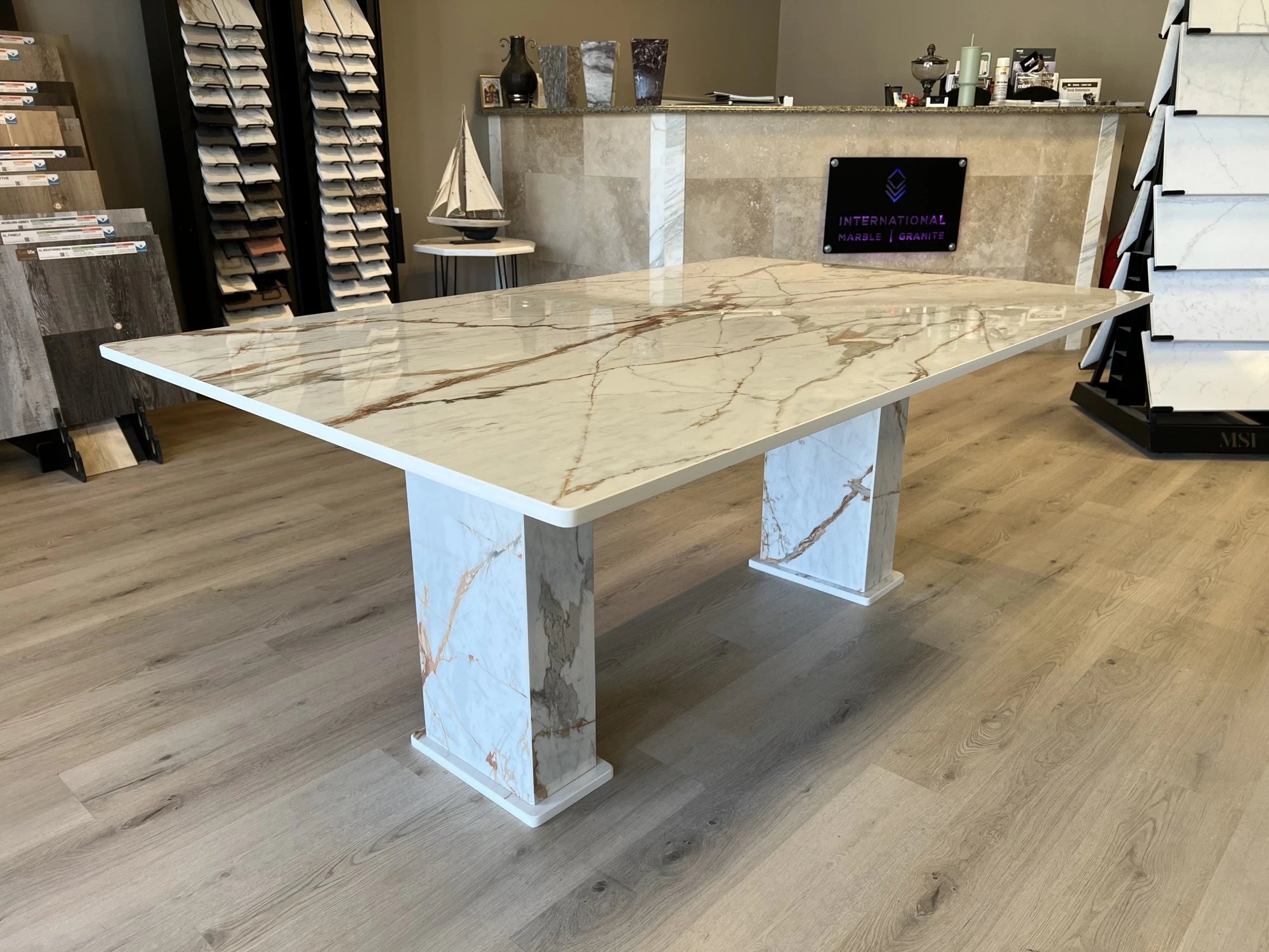 Dekton Awake dining table with warm beige tones and subtle veining — premium dekton surfaces fabricated and installed by Signature Stone LV