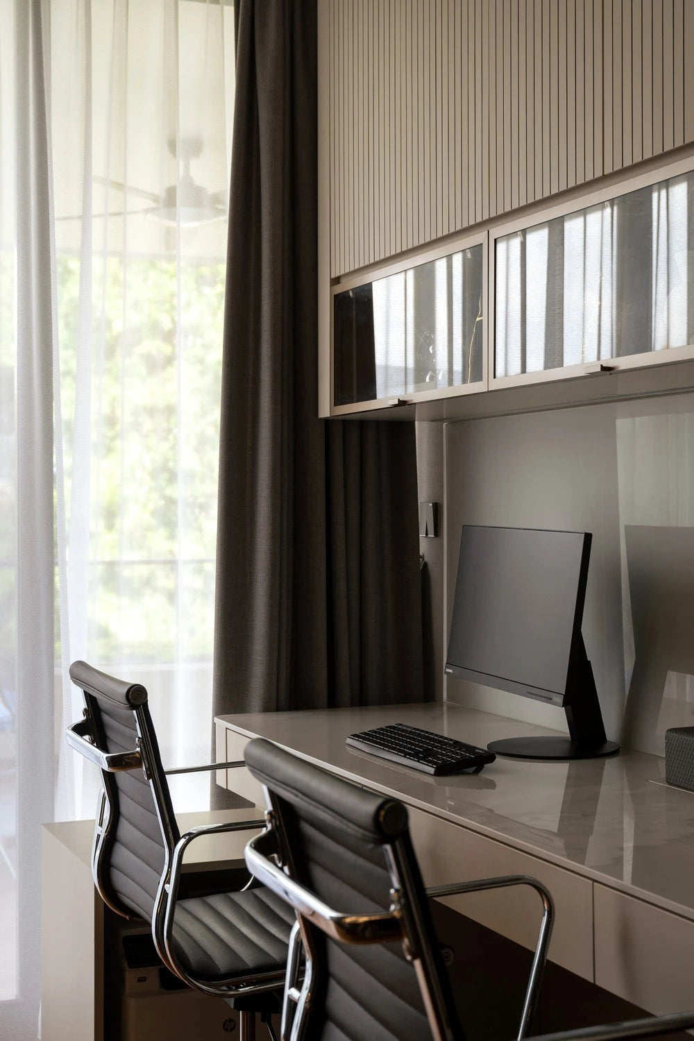 Dekton Bergen office desk with glossy white finish and clean lines — premium dekton surfaces fabricated and installed by Signature Stone LV
