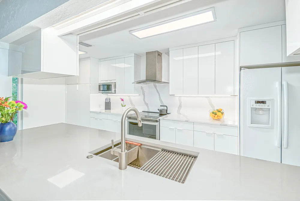 Silestone Bianco Calacatta kitchen island with white veined surface and undermount sink — premium quartz countertops near me by Signature Stone Las Vegas