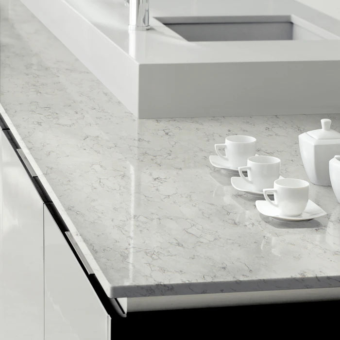 Silestone Blanco Orion kitchen island with white marble-look veining and polished finish — engineered quartz countertops fabricated and installed by Signatur...