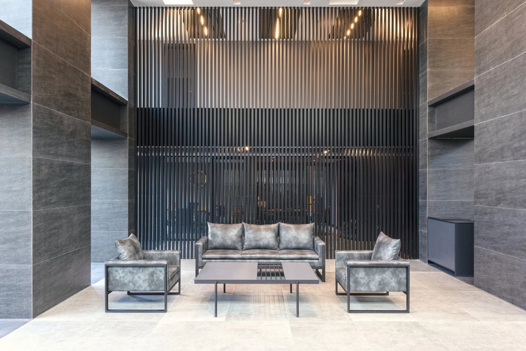 Dekton Bromo wall cladding with vertical slat design in modern gray tones — premium dekton countertops installed by Signature Stone Las Vegas