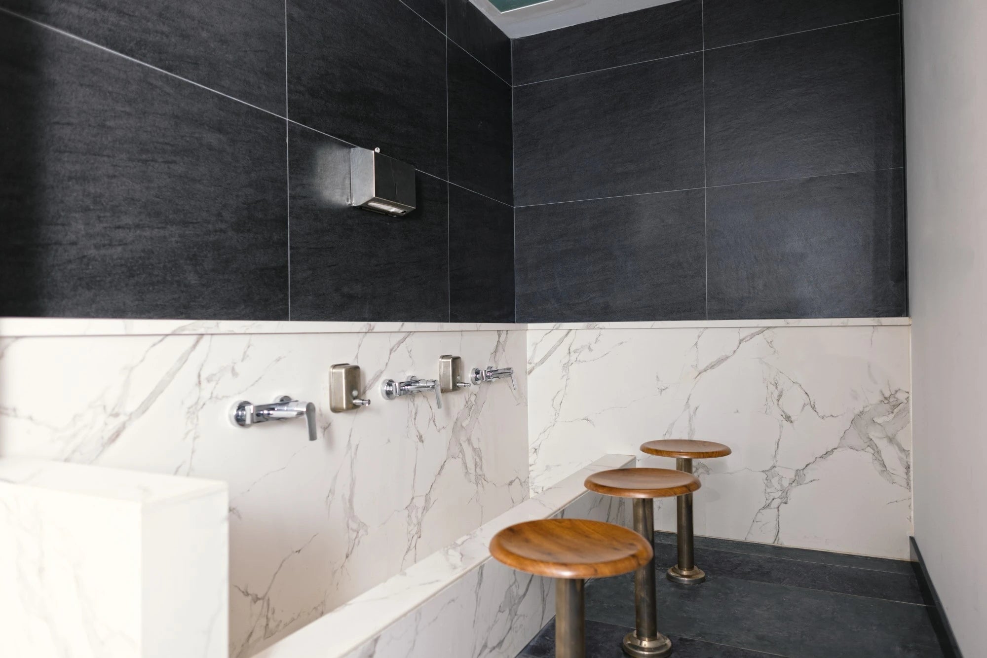 Dekton Bromo bathroom vanity with dark charcoal finish and modern edge detail — premium dekton countertops installed by Signature Stone Las Vegas