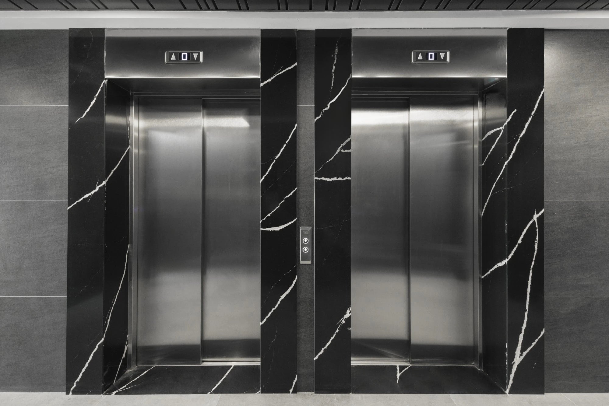 Dekton Bromo black marble-look elevator surround with white veining — dekton kitchen countertops by Signature Stone Las Vegas