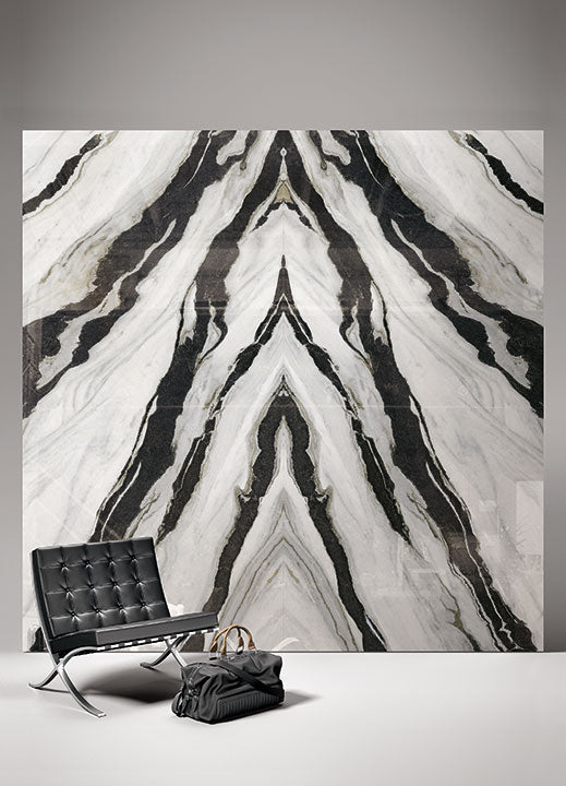 Calacatta Panda marble wall with dramatic black veining and book-matched pattern — custom countertops fabricated and installed by Signature Stone LV