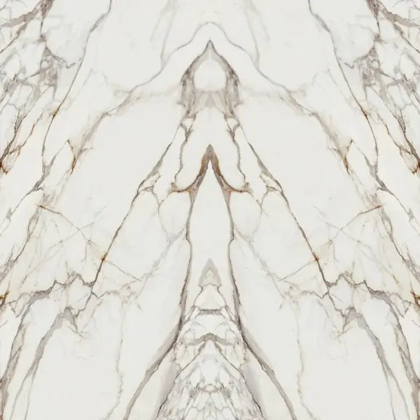 Calacatta Dorato marble surface with dramatic white base and bold grey veining in symmetrical book-matched pattern — custom countertops fabricated and instal...