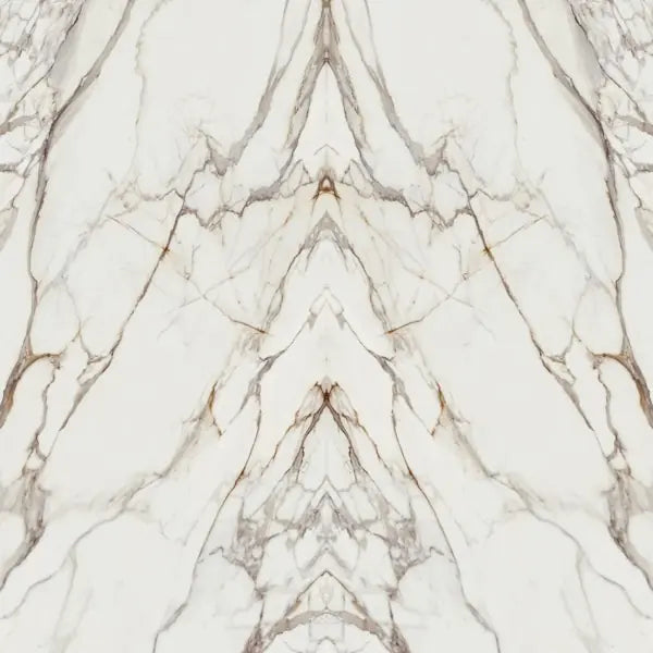 Calacatta Dorato marble slab with white base and gold-brown veining — premium countertop fabrication by Signature Stone Las Vegas