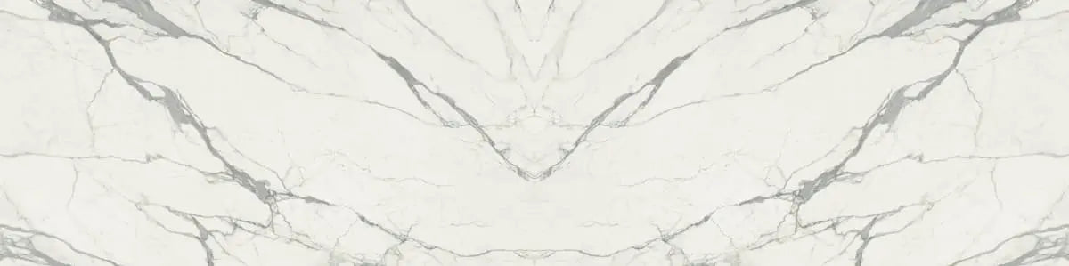 Calacatta Supremo marble surface with white base and gray veining in bookmatched pattern — custom countertops fabricated and installed by Signature Stone LV