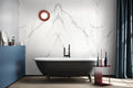 Calacatta Supremo marble bathroom wall with white background and gray veining — premium stone countertops installed by Signature Stone Las Vegas