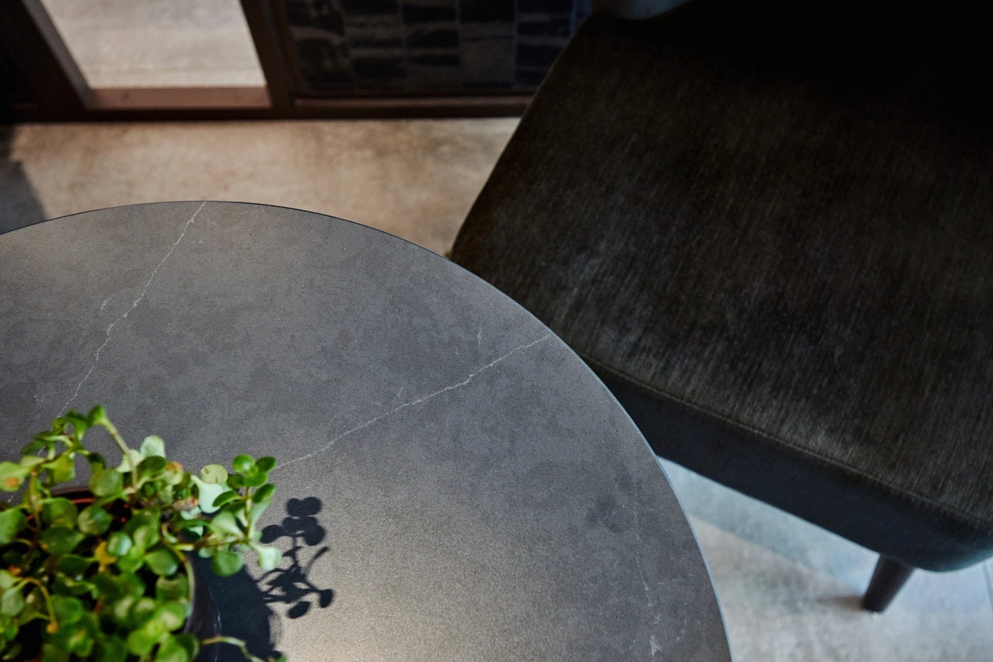 Silestone Charcoal Soapstone dining table surface with dark veining and matte finish — quartz countertops installed by Signature Stone Las Vegas