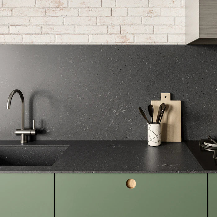 Silestone Cinder Craze kitchen countertop with dark speckled surface and integrated sink — engineered quartz countertops fabricated and installed by Signatur...