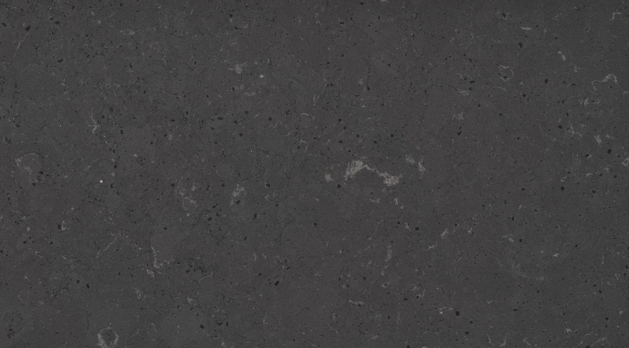 Silestone Cinder Craze slab surface with dark charcoal base and subtle light veining — premium quartz countertops installed by Signature Stone Las Vegas