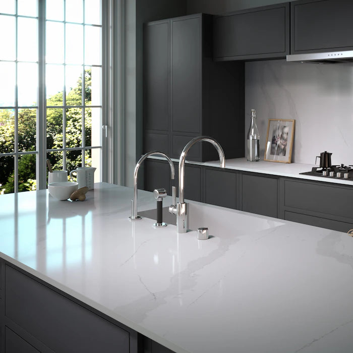 Silestone Classic Calacatta kitchen island with white marble-look surface and polished finish — engineered quartz countertops fabricated and installed by Sig...
