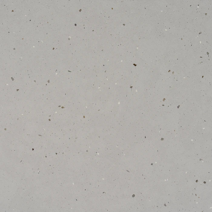 Silestone Concrete Pulse surface with light gray background and scattered dark speckles — premium quartz countertops installed by Signature Stone Las Vegas