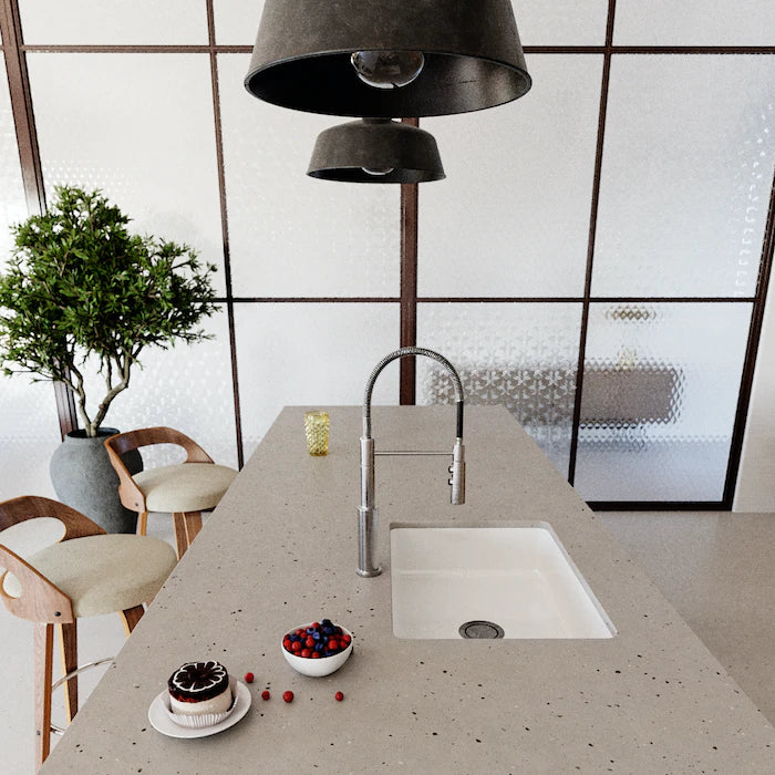 Silestone Concrete Pulse kitchen island with speckled gray finish and undermount sink — engineered quartz countertops fabricated and installed by Signature S...