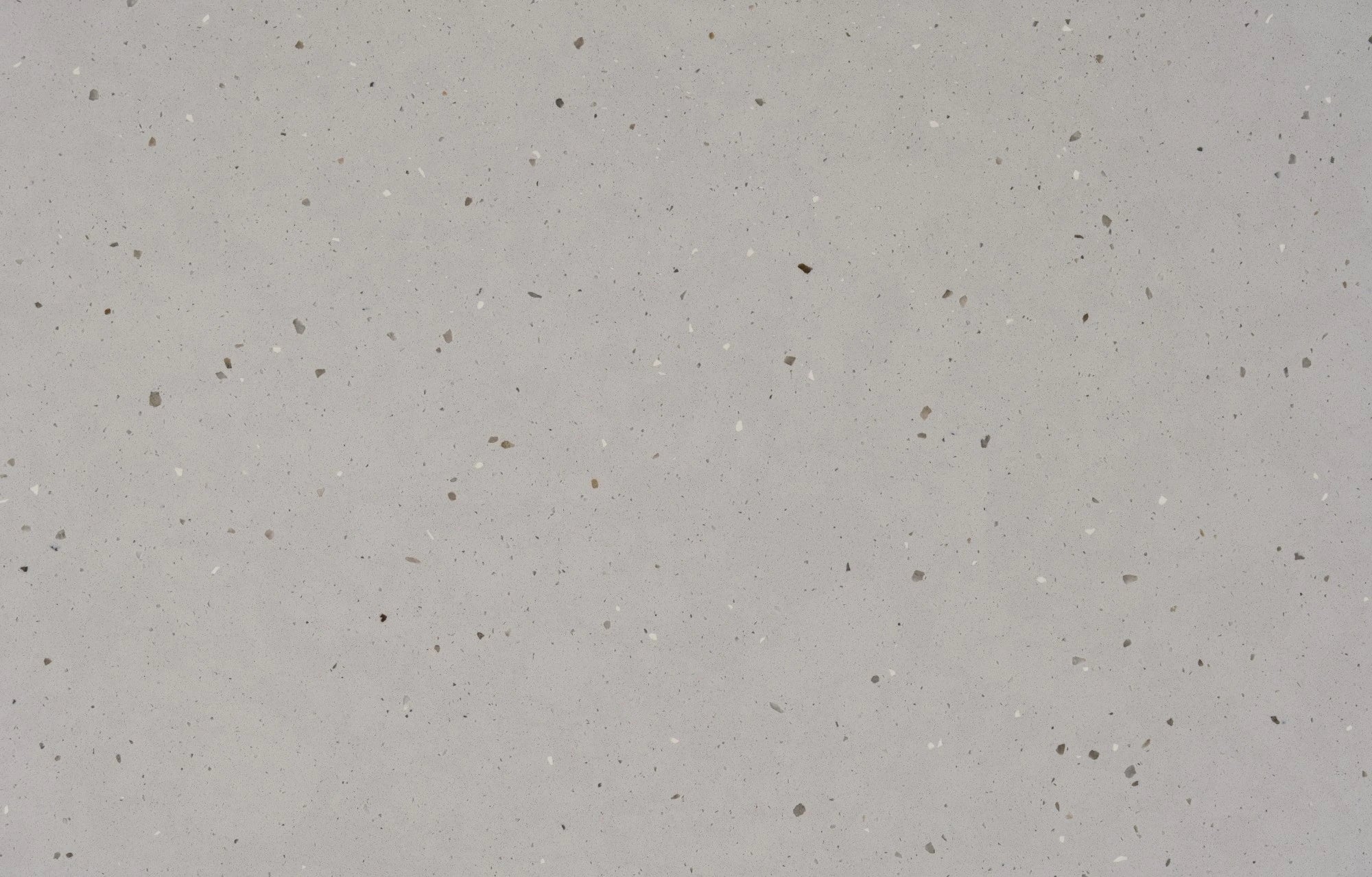 Silestone Concrete Pulse quartz surface with gray base and scattered dark speckles — premium quartz countertops installed by Signature Stone Las Vegas