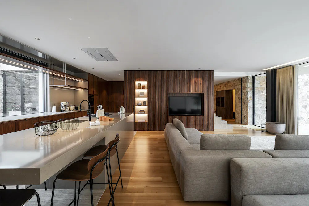 Silestone quartz kitchen island with white surface and waterfall edge in modern open concept space — quartz countertops near me by Signature Stone Las Vegas