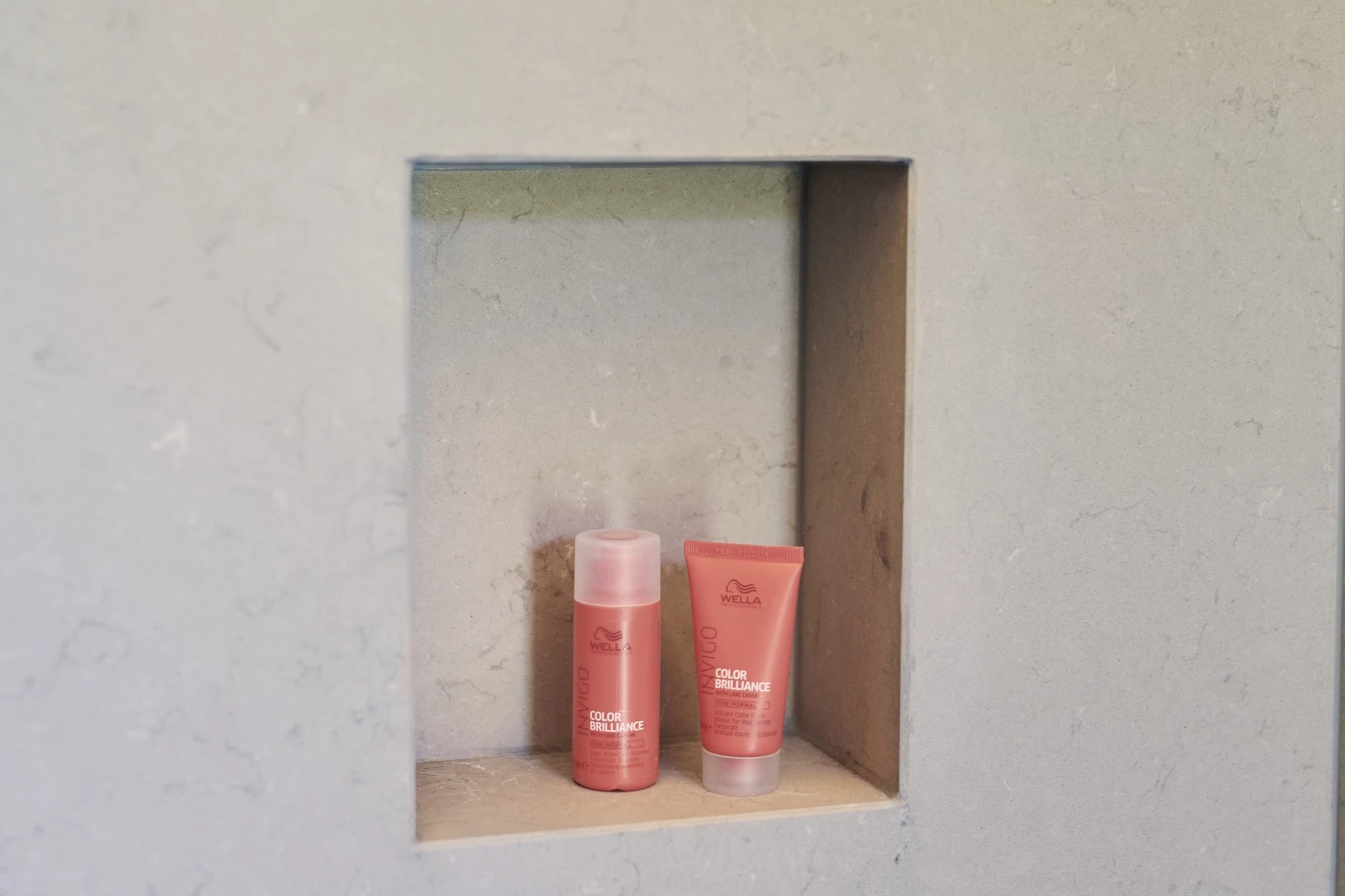 Silestone Coral Clay quartz shower niche with warm peachy-pink tone and smooth matte finish — quartz countertops installed by Signature Stone Las Vegas