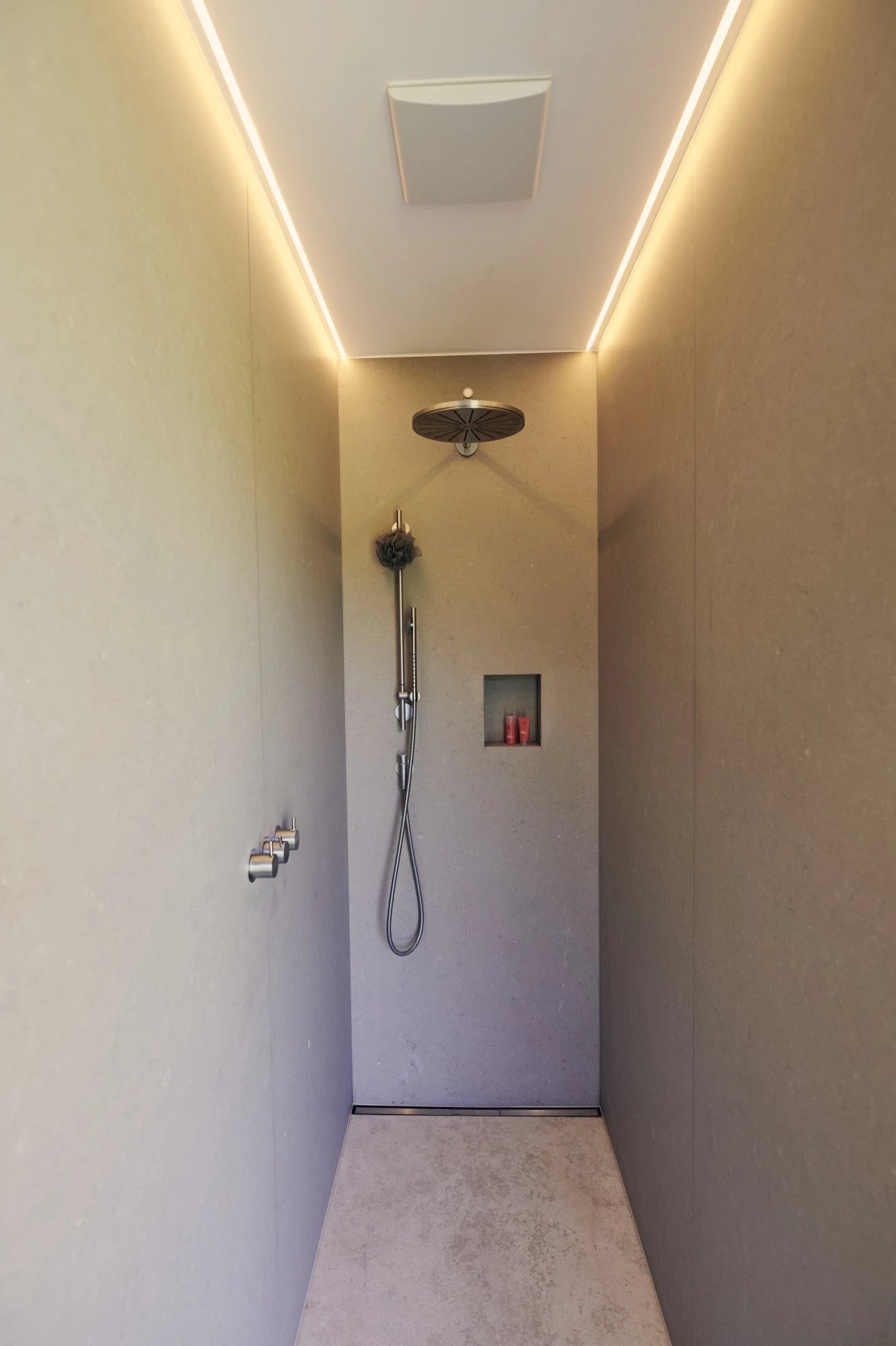Silestone Coral Clay quartz shower walls with warm beige finish and integrated lighting — premium quartz countertops near me by Signature Stone Las Vegas