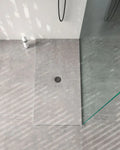 Dekton shower tray with gray textured surface and circular drain — dekton countertops installed by Signature Stone Las Vegas