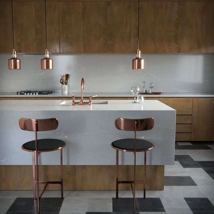 Silestone Desert Silver kitchen island with smooth gray finish and waterfall edge — engineered quartz countertops fabricated and installed by Signature Stone LV