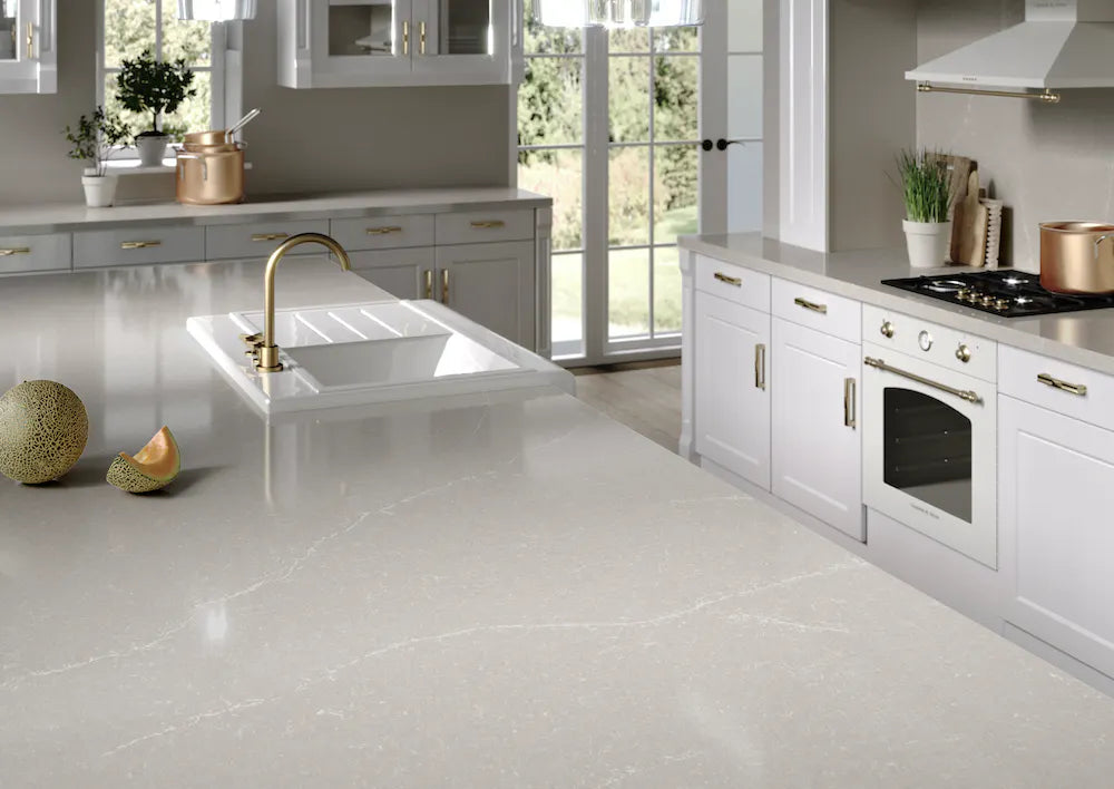 Silestone Desert Silver quartz kitchen countertops with polished finish and brass faucet — premium quartz countertops near me by Signature Stone Las Vegas