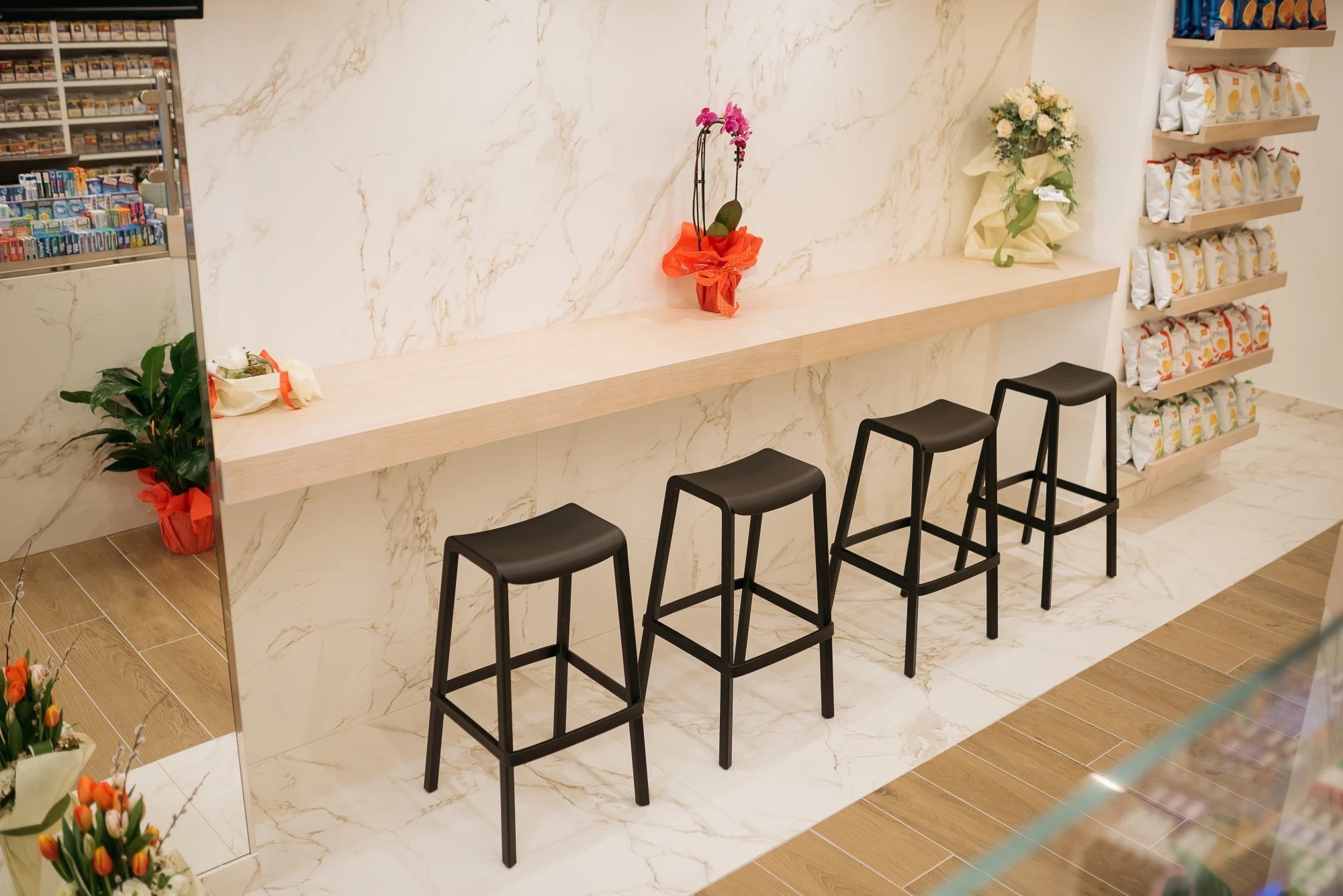 Dekton Entzo countertop with white marble veining and waterfall edge — premium dekton surfaces fabricated and installed by Signature Stone LV