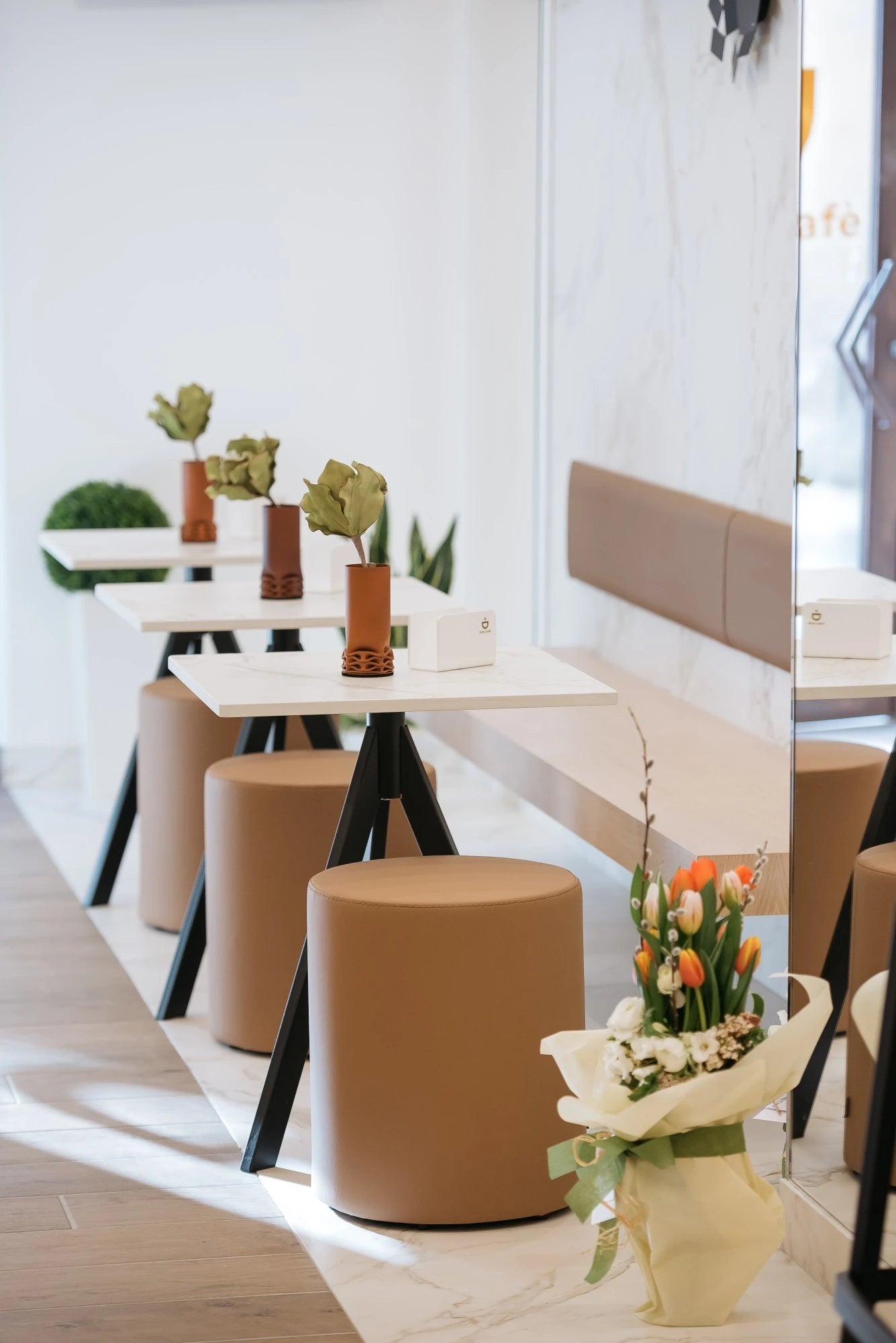 Dekton Entzo surfaces in modern white café seating with clean lines and minimalist design — premium dekton kitchen countertops by Signature Stone Las Vegas