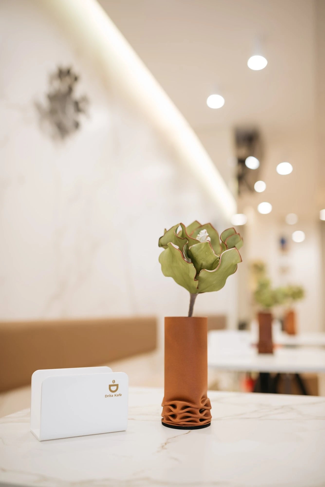 Dekton Entzo countertop with decorative vase in modern kitchen setting — premium dekton surfaces fabricated and installed by Signature Stone LV