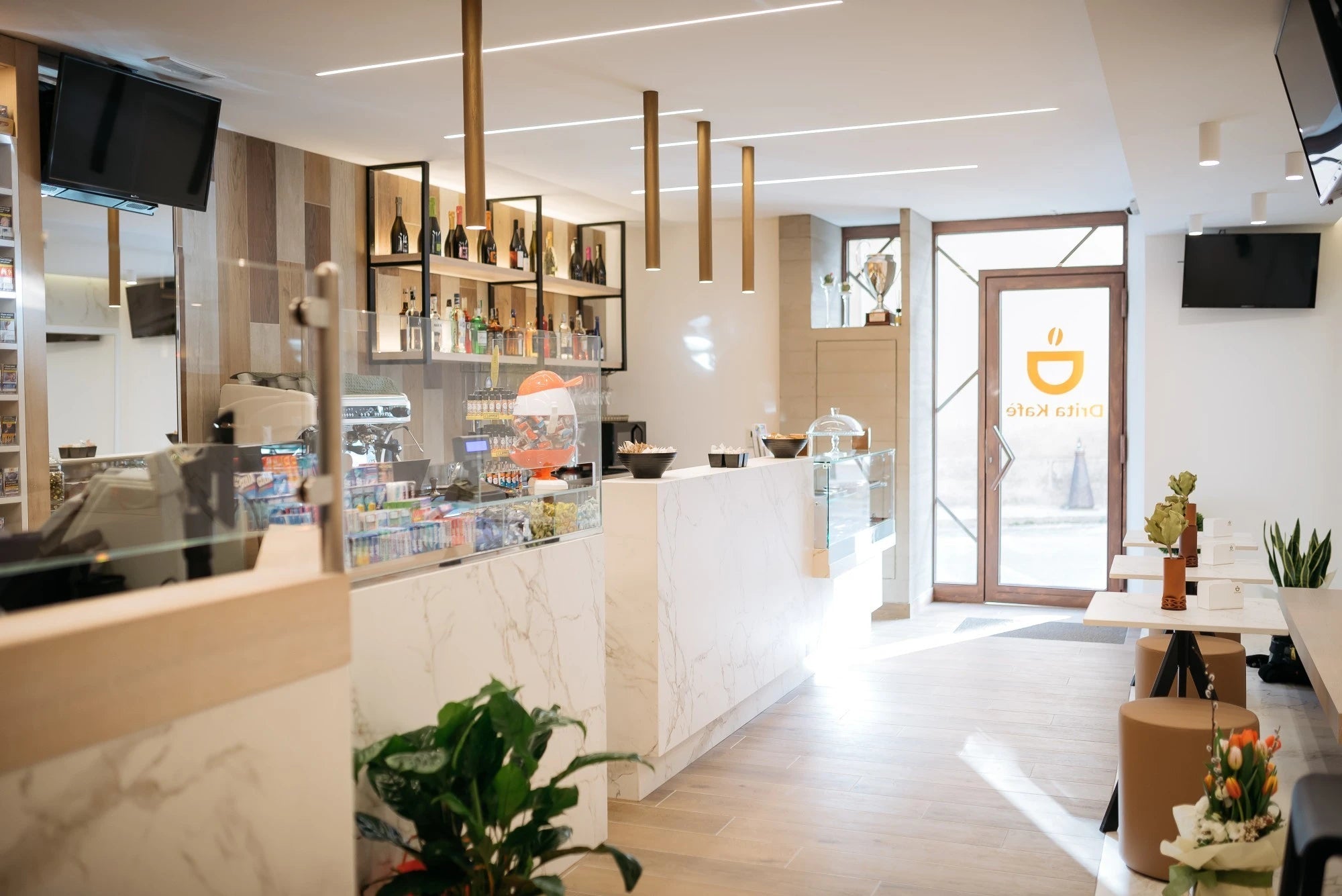 Dekton Entzo quartz surfaces with white marble veining in modern commercial space — premium dekton kitchen countertops by Signature Stone Las Vegas