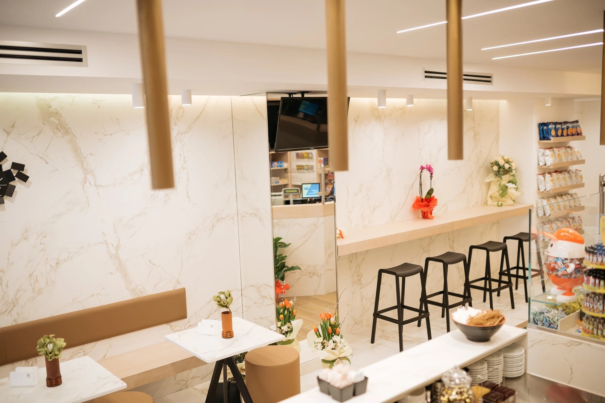 Dekton Entzo commercial bar counter with white marble-look finish and waterfall edge — dekton countertops installed by Signature Stone Las Vegas