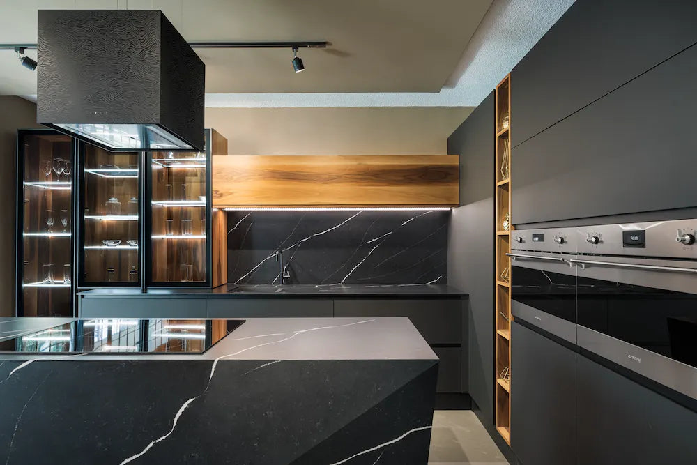 Silestone Et Marquina quartz kitchen countertops with dramatic black marble veining and waterfall edge — premium quartz countertops near me by Signature Ston...
