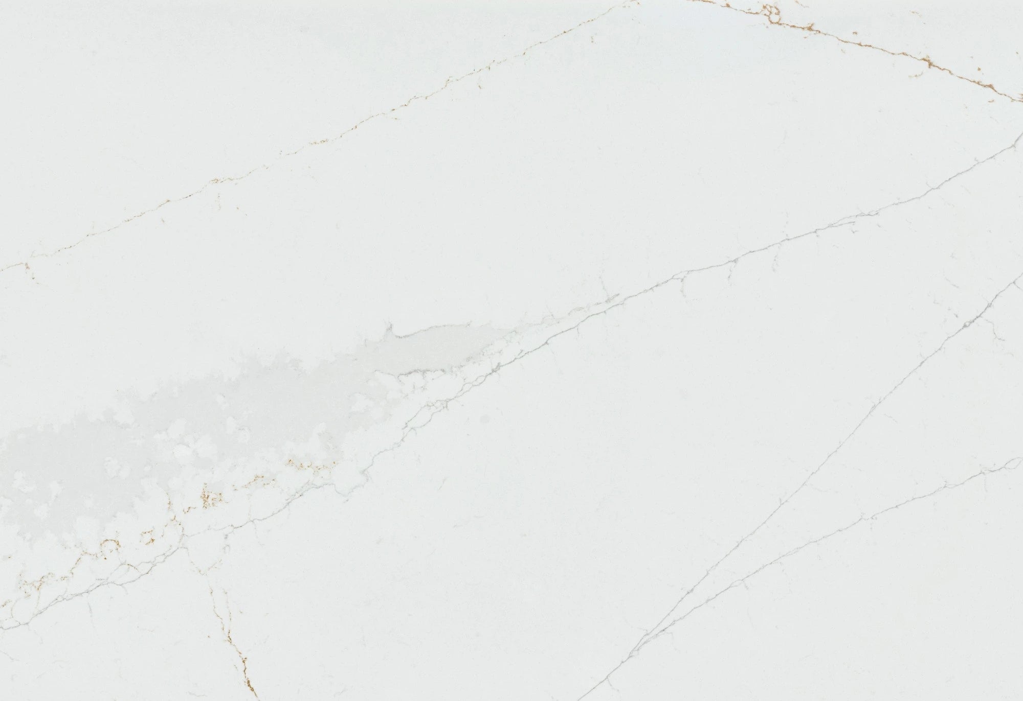 Silestone Ethereal Glow surface with pale gray background and subtle golden veining — engineered quartz countertops fabricated and installed by Signature Sto...