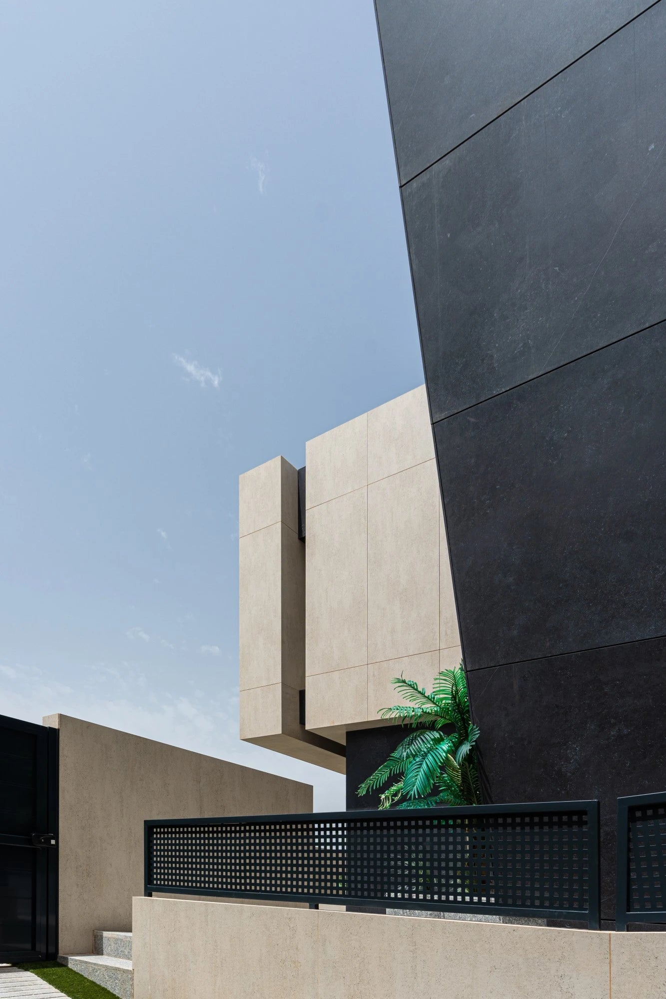 Dekton Fossil exterior wall cladding with beige tone and smooth matte finish — premium dekton surfaces fabricated and installed by Signature Stone LV